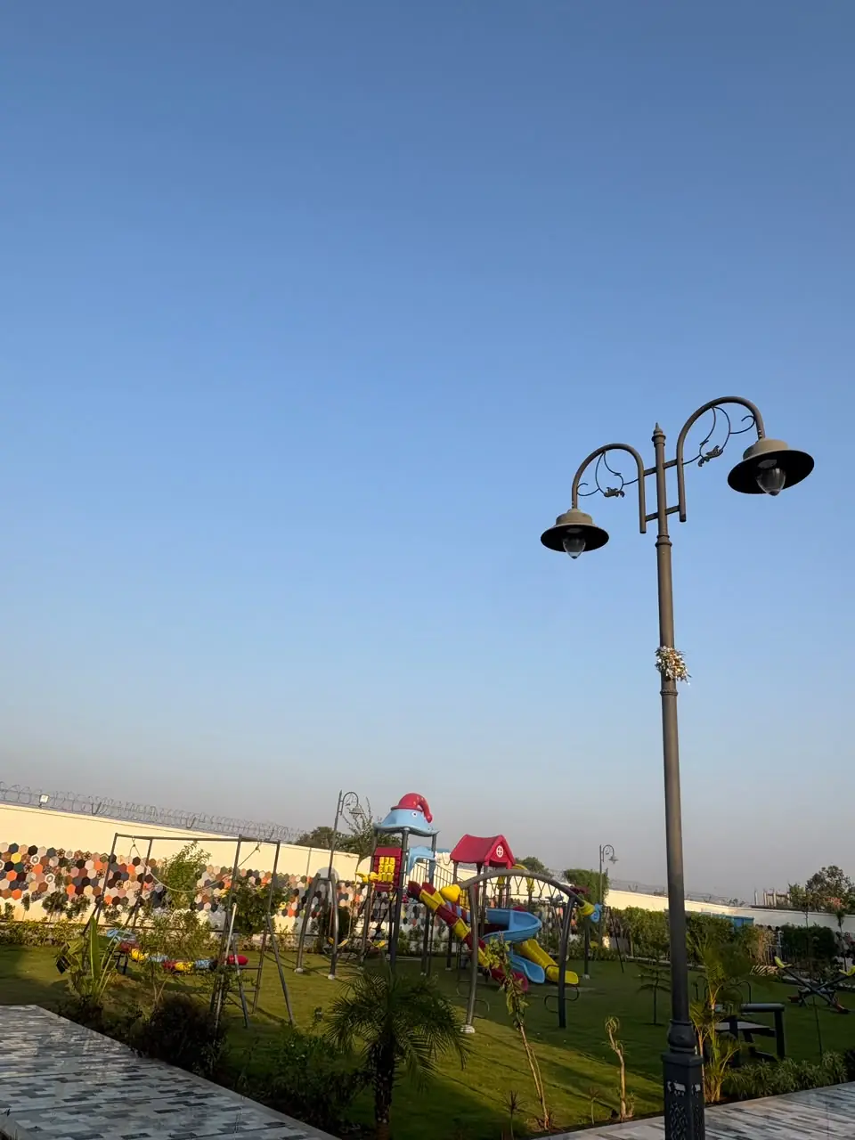Ornamental lamp posts by the play area — JHM Aura